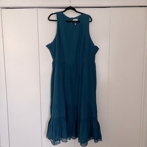NWT maxi dress in stunning sea blue color. Feminine ruffle detail on button. 3x.